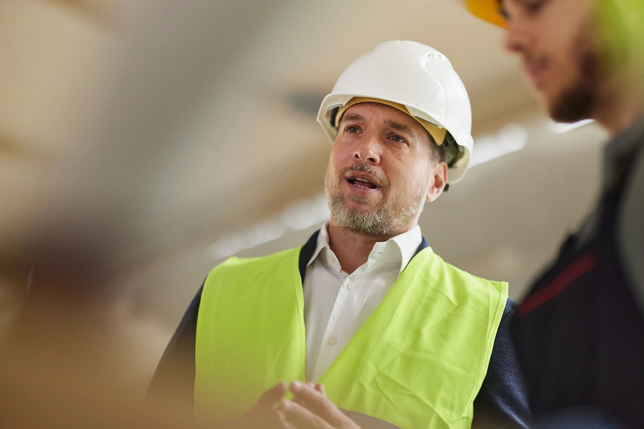Construction professional speaking on a job site